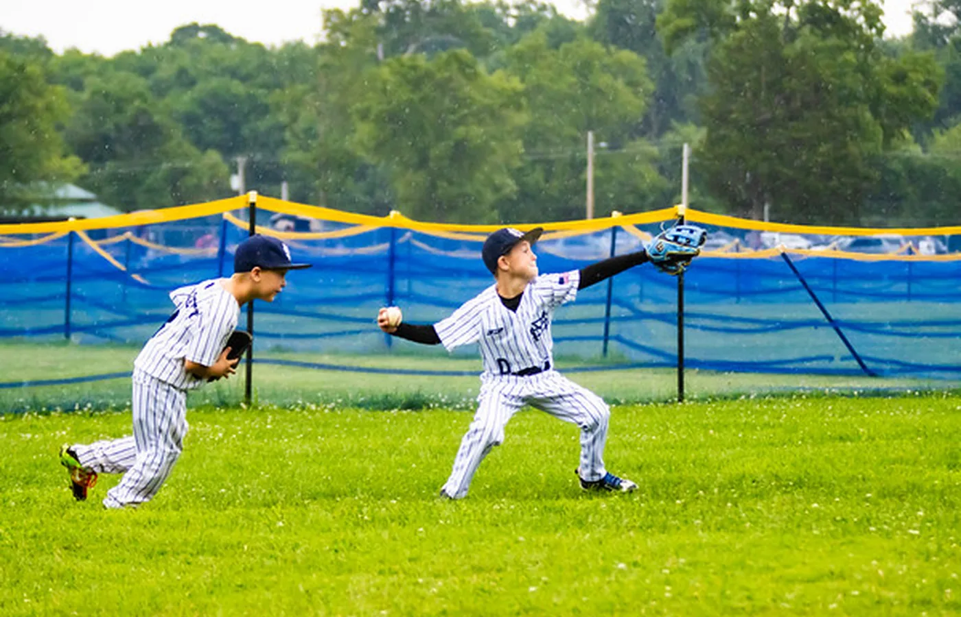 Missouri Steel players pursuing a fly ball